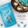 A bag of Lindt Lindor Salted Caramel chocolates is shown next to cups of coffee and a tray of chocolates. Anteprima dell’immagine prodotto