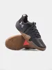 A pair of black Under Armour sports shoes on a light gray background. Anteprima dell’immagine prodotto