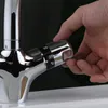 A hand is adjusting the temperature control on a chrome faucet. Náhled obrázku produktu