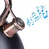 A close-up view of a whistling kettle's spout with musical notes emanating from it. Náhled obrázku produktu