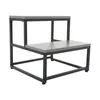 A two-step stool with a gray wood-grain finish and black metal frame, shown against a white background. Náhled obrázku produktu