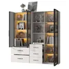 A modern, illuminated display cabinet with glass doors and open shelves, filled with decorative items and books. Anteprima dell’immagine prodotto