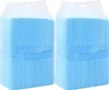 Two stacks of blue disposable dog pee pads in clear plastic packaging. Produktbild-Vorschau
