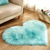 A heart-shaped fluffy rug is placed on a wooden floor next to a sofa. A basket of books is visible in the background.