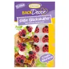 A product package for cake decorations, featuring images of decorated cakes and the product itself. Anteprima dell’immagine prodotto