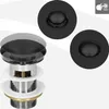 A collage of images showing a black sink drain assembly from different angles, including a close-up and a diagrammatic view of its components. Podgląd zdjęcia produktu