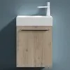 A modern bathroom vanity with a white sink and a wood-grain cabinet against a blue wall. Produktbild-Vorschau