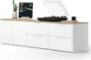 A white and wood-tone media console with a record player, a vinyl record, and a plant on top. Náhled obrázku produktu