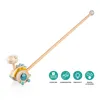 A wooden dinosaur push toy with a long handle, shown on a white background with marketing icons. Anteprima dell’immagine prodotto