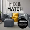 A modular sofa system with a gray ottoman and a yellow accent seat, displayed in a living room setting. Produktbild-Vorschau