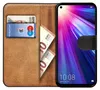 A book-style phone case with a phone inserted, showing cards and banknotes in the slots. Náhled obrázku produktu