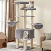 A multi-level cat tree with several cats on it, placed in a living room setting. Produktbild-Vorschau