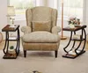 A living room scene with a chair and two side tables. Produktbild-Vorschau