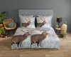 A bedroom scene with a bed dressed in duvet cover featuring reindeer. Podgląd zdjęcia produktu