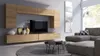 A modern living room with a wall-mounted entertainment unit, sectional sofa, and coffee table. Náhľad obrázku produktu