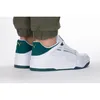 A person wearing Puma sneakers. Produktbild-Vorschau