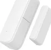 Two white magnetic contact sensors for doors and windows, angled against a white background. Anteprima dell’immagine prodotto