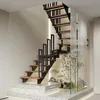 A modern interior with a sleek staircase and a small indoor garden. Náhľad obrázku produktu