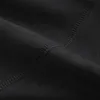 A close-up view of black fabric with visible stitching. Podgląd zdjęcia produktu