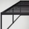 A close-up view of the black metal frame of a bed. Produktbild-Vorschau