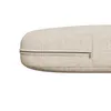 A close-up view of a beige cushion with a zipper. Náhľad obrázku produktu