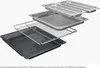 An exploded view of oven accessories, including baking trays and a wire rack, arranged in layers. Produktbild-Vorschau