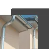 Close-up view of a house's gutter system, showing downspouts and gutters attached to the exterior wall. Produktbild-Vorschau