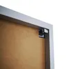 A close-up view of the corner of a picture frame, showing the backing and a mounting bracket. Produktbild-Vorschau