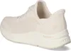 A side view of a cream-colored Skechers shoe. Produktbild-Vorschau