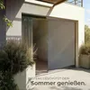 A modern patio with a large sliding glass door covered by a gray vertical awning. Náhled obrázku produktu