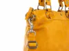 A close-up of a yellow leather handbag strap and hardware. Produktbild-Vorschau