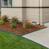 A garden bed border is installed along a concrete walkway and a lawn in front of a house. Náhled obrázku produktu