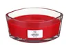 A red WoodWick candle in a clear glass container. Produktbild-Vorschau