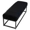 A black upholstered bench with a metal frame, shown from a diagonal angle against a white background. Náhled obrázku produktu