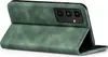 A green flip cover case for a smartphone, shown from a diagonal angle with the cover open. Produktbild-Vorschau
