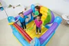Three children are playing in a colorful inflatable trampoline with a rainbow design. Voir les images du produit
