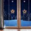 Two star-shaped LED lights hang in a window overlooking a snowy forest at night. Anteprima dell’immagine prodotto