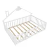 A white wooden children's bed frame with a house-shaped canopy and a built-in safety fence. Podgląd zdjęcia produktu