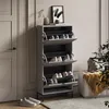 A modern shoe cabinet with multiple flip-out drawers, placed in a home entryway next to a door and a sofa. Anteprima dell’immagine prodotto