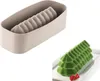 A silicone mold for baking and a finished cake shaped like a Christmas tree. Produktbild-Vorschau