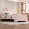 A child's bedroom featuring a pink bed with bunny ears on the headboard. Voir les images du produit