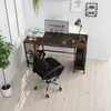 A home office setup with a computer desk, chair, and computer. Voir les images du produit