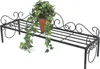 A black metal plant stand with a potted ivy plant on it. Anteprima dell’immagine prodotto