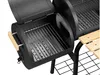 A close-up view of a black charcoal smoker grill with wooden handles and a wooden side table. Produktbild-Vorschau