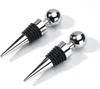Two silver bottle stoppers with black rubber seals are shown on a white background. Produktbild-Vorschau