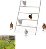 A multi-tiered wooden ladder with metal supports, designed for chickens to perch on, is shown against a white background. Several chickens are positioned on and around the ladder. Náhled obrázku produktu