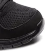 A close-up view of the toe area of a black SKECHERS sneaker, showing the mesh and synthetic materials. Anteprima dell’immagine prodotto