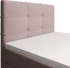 Close-up of a bed with a pink tufted headboard and a white mattress. Voir les images du produit