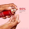 A hand is dispensing serum from a Clarins bottle onto a finger. Podgląd zdjęcia produktu