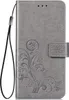 A grey flip case cover for a phone with a floral embossed pattern and a wrist strap. Produktbild-Vorschau